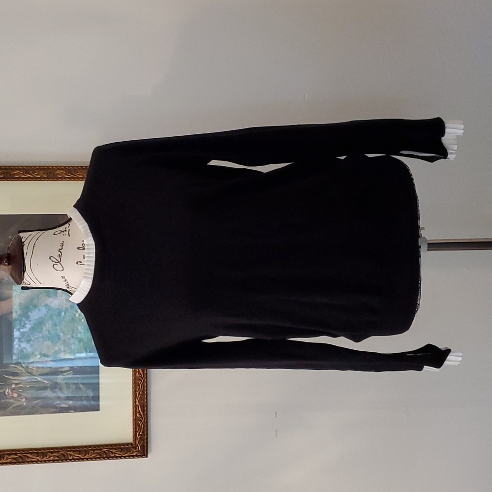 Black sweater with faux white shirt peaking out